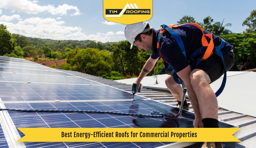 Workers installing solar roofing on a commercial building